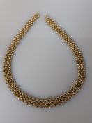 A 9ct yellow gold brick-link necklace, 46 cm, import hallmarks, 25.6g