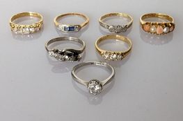 A solitaire diamond ring in a platinum illusion setting, approximately 0.40 carats