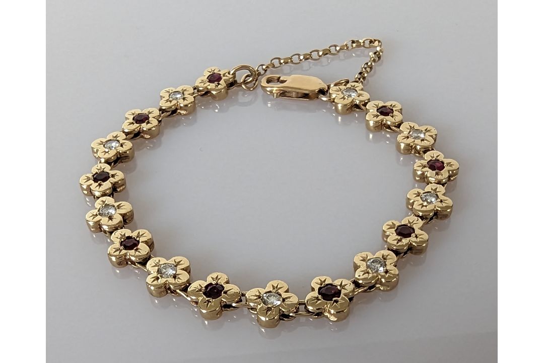 A 9ct gold bracelet with diamond and garnet floral design, hallmarked, 15.5 cm, 20g - Image 1 of 3