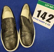 A Pair of GUCCI GG Embossed Leather Slip on Trainers in Black with Double G Monogram and White