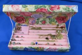 Vintage jewelry box with rings and necklaces