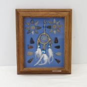 Framed Native American display with arrow heads