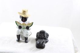 2 Black Americana Figurines Man on Commode & Baby