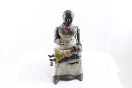 Black Americana Mammy Feeding Baby Mechanical Bank