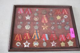 Collection of North Vietnamese Medals Framed