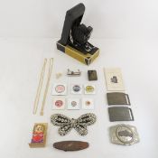 Belt buckles, pins, camera, jewelry & more
