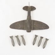 WWII Trench art airplane & 6 lazy dog bombs