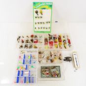Collection of fly fishing lures, some on displays