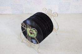 23 45 RPM Records with Stand