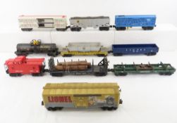 10 Lionel boxcars, tankers, flat cars & more