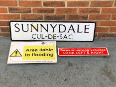 Three Metal Road Signs