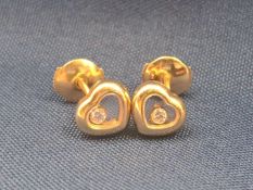 CHOPARD, a pair of “Happy Diamond” glazed heart shaped earrings