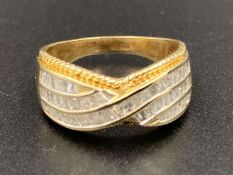 A Diamond set, 9ct yellow gold, crossover band, with braided surround.