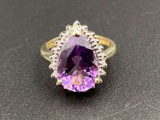 A pear cut Amathyst & Diamond, 9ct gold Halo ring.