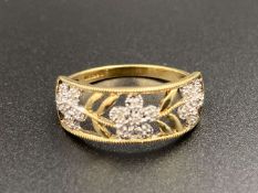 A diamond set, floral open work, 9ct yellow gold ring.