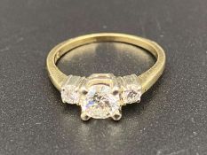 A Diamond, three stone, 18ct gold ring.