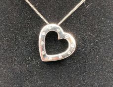 A diamond set 9ct white gold, heart shaped pendent.