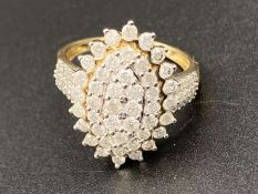 A Marquise shaped, diamond set, 9ct yellow gold cluster ring.