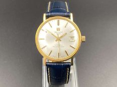 TISSOT, “ Seastar Seven”, 9ct gold, automatic, centre seconds, calendar wristwatch.&nbsp;
