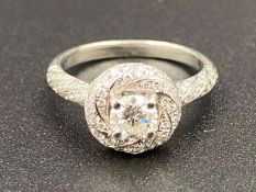 A Certificated Diamond set twist halo cluster ring.