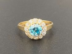 A white and blue stone 18ct gold cluster ring