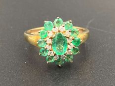An Emerald & Diamond 9ct gold cluster ring