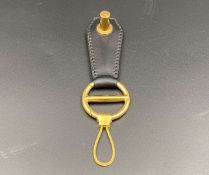 DUNHILL, a gilt metal and stitched black leather keyring,&nbsp;