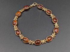 An amber set 9ct gold bracelet