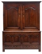 A George II oak cupboard,