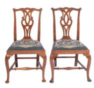 A pair of late George II or George III walnut side chairs in Chippendale taste,