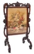 A William IV rosewood and petit point embroidered firescreen,