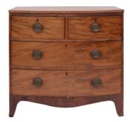 A late George III mahogany bowfront chest of drawers, circa 1800; the top with reeded edges,