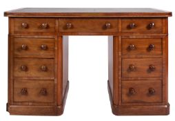 A mahogany pedestal desk in Regency style,