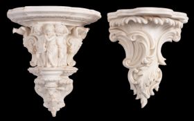 Two Parian wall brackets,