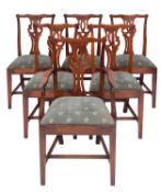 A set of six stained hardwood dining chairs in George III Chippendale taste,