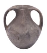A Chinese black pottery two-handled vase the neck with an incised band,