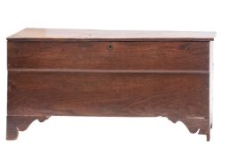 An oak coffer, elements 17th century and later; with a hinged top, on bracket front feet,
