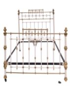 An Edwardian brass mounted metal bed, in Aesthetic Movement style,
