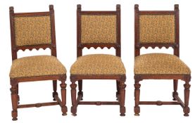 A set of eight Victorian carved oak and upholstered dining chairs,