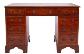 A mahogany and leather inset pedestal desk in late George III style,