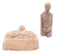 A Greek carved terracotta frieze section and a stone figure of a woman the first carved with a mask