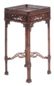 A mahogany urn stand in Chippendale style,