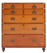 An Irish Victorian teak and brass bound campaign chest of drawers,