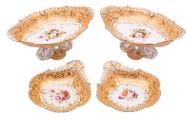A pair of English porcelain comports and a pair of matching shell shaped dishes each enamelled with