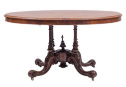 A Victorian walnut oval centre table,