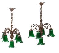 A pair of French gilt metal and glass five light electroliers,