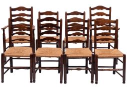 A composed set of eight ash and rush seated ladderback chairs,