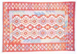 A smaller Anatolian Turkish Kelim, the ivory field with two rows of serrated medallions,