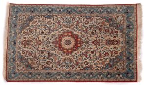 An Ispahan rug, the ivory cartouche field with central rust cartouche pole medallion,