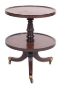 A Regency mahogany two tier dumb waiter, in the manner of Gillow,
